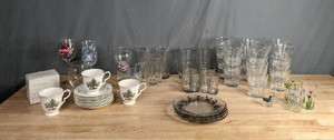 lot 174 image: Decorated Wine Glasses, Shoebox Greetings Mug, Happy Holidays Plates and Mugs, Clear Christmas Decorated Plates, Coca Cola Glass and Various Sized Clear Glasses  M