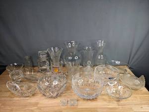 lot 176 image: A 23-Piece Assortment of Clear Vases, Bottles, Bowls Including Minnesota Golden Gophers Glass Mug, Crystal Clear Industries Bowl, Hen Glass Dish and More  M