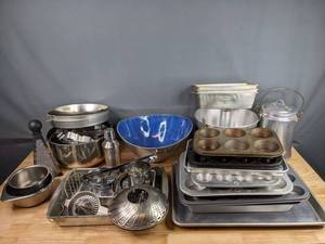 lot 181 image: Stainless Colored Muffin Pans, Cake Pans, Walker Ware Canister, Stainless Mixing Bowls, Cookie Cutters, Potato Ricer and More  M
