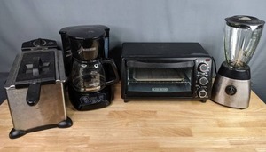 lot 184 image: Kitchen Essentials Black & Decker Coffee Pot, Black & Decker Toaster Oven, Home Depot Blender, & Bella Cucina Fryer M