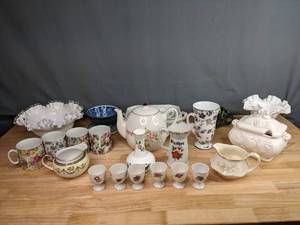 lot 169 image: (27) Assorted Teacups, Saucers, Teapots (Milk Glass, Homer Laughlin, Noritake and more) M