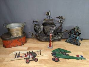 lot 213 image: Vintage Cast Iron & Metal Decor (2) Airplanes, Windmill Music Box, Ship, Mini Texaco Gas Pump, Galvanized Bucket, Tin with Lid & Handles  M