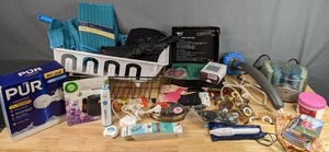 lot 216 image: Mixed Lot PUR Maxion Water Filter System, Conair Massager, (2) Dish Drainers, NEW Kitchen Towels & Drying Mats, Beauty Supplies, and Much More  M