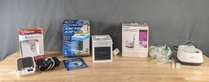 lot 259 image: Omron 5 Series Blood Pressure Monitor, Arctic Air Evaporative Cooler, and Philips Respironics  M