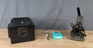 lot 267 image: Ambico FilmSlide Projector, Box of Prepared Slides, and Ken-A-Vision Microscope  M