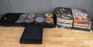 lot 264 image: Magnavox DVD Player with Large Collection of DVDs Star Wars, Game of Thrones, Harry Potter, Shrek, X-Men, Star Trek, and Much More  M