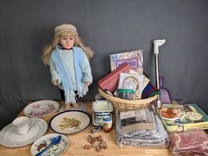 lot 320 image: NEW Blow Up Turkey, Fine China Plates, 84-Inch Black Out Panels,  My Twinn Doll, Guest Register, Dream Catcher, Laundry Basket and More M
