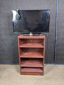 lot 299 image: RCA TV with Remote, TV Stand and Headphones  M