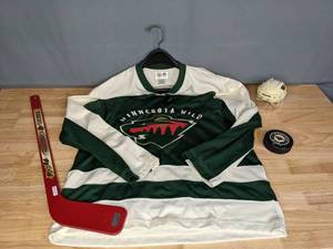 lot 60 image: Minnesota Wild Hockey Youth Large Jersey, Pucks, Helmet and Stick E