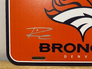 lot 9 image: Denver Broncos Russell Wilson Autographed NFL Football Collectors License Plate QB R