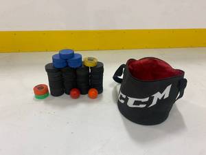 Lot of Hockey Pucks with Bag