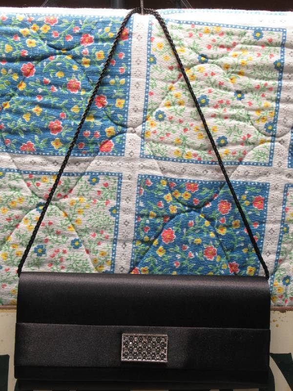 lot 65 image: Style & Co. Black Clutch