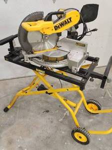 lot 6 image: DeWalt Compound Miter Saw with a Portable Stand