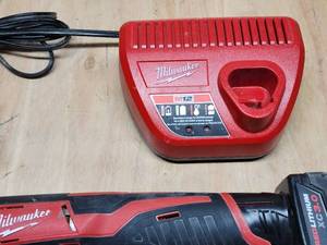 lot 201 image: Assorted Milwaukee Cordless Tools with Charging station