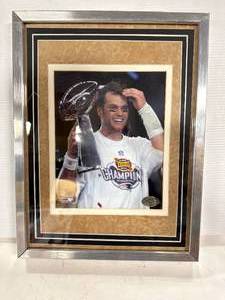lot 45 image: Tom Brady Metal Framed Photo 13x17 Inch