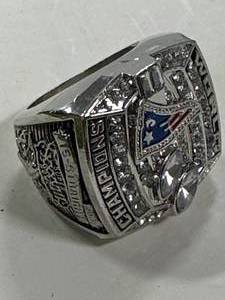 lot 56 image: 2003 New England Patriots Tom Brady Championship Replica Ring