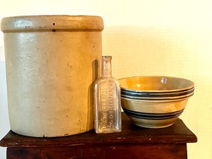 lot 44 image: Collection of Primitives including a Crock, Mixing Bowls, Bench, Utensils and Two Bottles