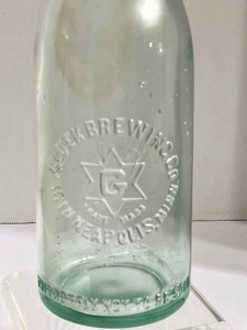 lot 55 image: Vintage Gluek Brewing Company Glass Bottle