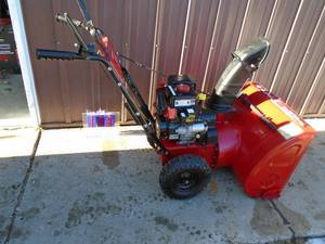 lot 103 image: 27 Snow Devil by MTD. 208 cc gas snow blower. Electric start. Tested & works. As shown.
