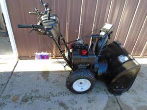 lot 104 image: Craftsman 9.5 gas snow blower. 27 cut. Electric start. Power turn braking controls. Tested & works. As shown. THIS ITEM HAS A RESERVE.