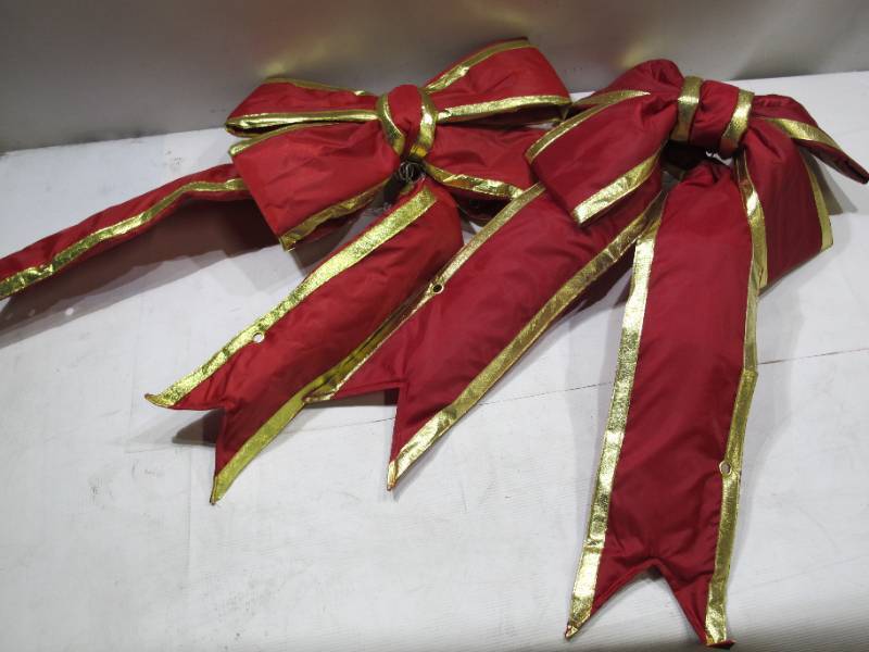 lot 780 image: 2 Pack of Vickerman 24-in. Red & Gold Finish Decorative Bows