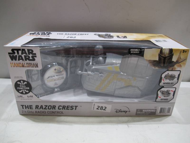lot 580 image: NEW Star Wars The Mandalorian The Razor Crest 2.4 GHz Radio Control 9 RC Car