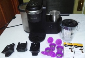 lot 126 image: Keurig Supreme With Accessories. Cup, Pot, Latte, Cappuccino options
