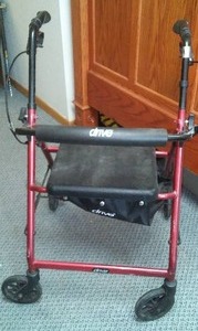 lot 133 image: 4 Wheel Walker, Brakes, Seat, Storage.