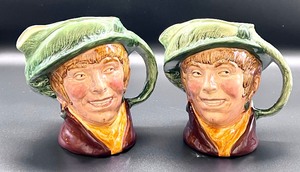 lot 54 image: Pair of Arriet Royal Doulton Toby Mugs