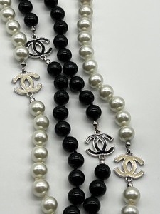 lot 226 image: Chanel Black and White Double Strand Faux Pearl Necklace