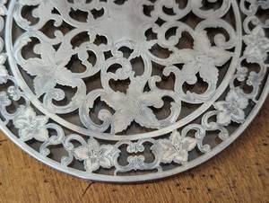 lot 117 image: Pair of Sterling and Glass Trivets