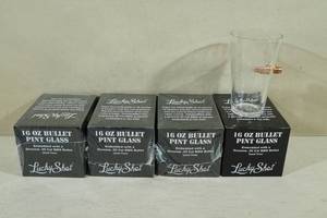 lot 134 image: Lucky Shot 16 Ounce Beer Pint Glasses with Embedded Bullets - Zombies