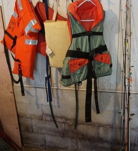lot 23 image: Fishing rods and life jackets