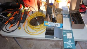 lot 37 image: Garage GoodsExtension Cords, Drill Bits in Case, Assorted Drill Bits in Wood Box, Circular SawBlade Clock Etc.