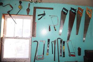 lot 51 image: Garage LotPegboard Full of Saws, Hand Tools Etc.