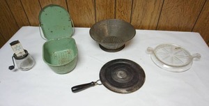 lot 135 image: Vintage Housewares including Porcelain No-Drip Sanette Sink Strainer, 8 in. Fire King Clear Glass Hot Plate Trivet, Nut Grinder Jar Etc.