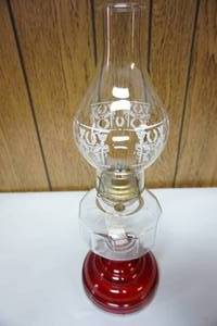 lot 216 image: Perfect for the mantle, red glass vase hurricane lamp