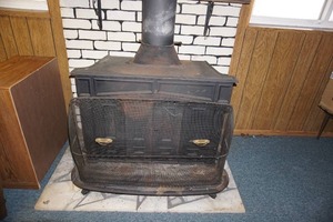 lot 233 image: Antique woodburning stove, cast iron with Screen protector
