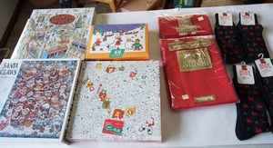 lot 268 image: Gift giving lot Includes puzzles, holiday stockings etc.
