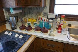 lot 369 image: Everything but the kitchen sink including blue vintage glassware, character glasses etc.