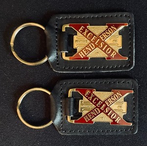 lot 180 image: Excelsior-Henderson Motorcycle Company Leather Coasters and Keychains