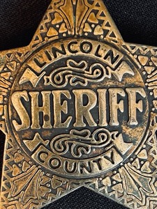 lot 196 image: Vintage Sheriff of Lincoln County Pin Back Badge