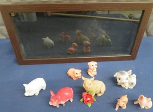 SHADOW BOX AND AND ASSORTMENT OF VINTAGE PIGS.