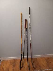lot 103 image: (4)  HOCKEY STICKS