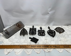 lot 30 image: Cast Iron Trivets