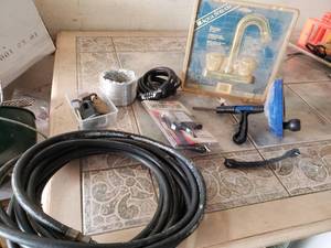 lot 57 image: Faucet, Plumbing Snake, and Other Items