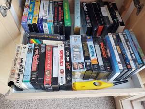 Collection Of VHS Tapes And DVDs
