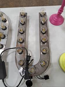 lot 819 image: 21  120V Decorative Letter U Light