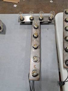 lot 822 image: 21  120V Decorative Letter T Light