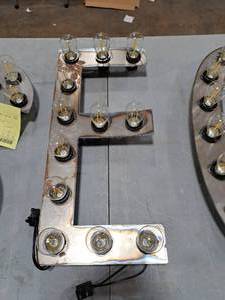 lot 824 image: 21  120V Decorative Letter E Light